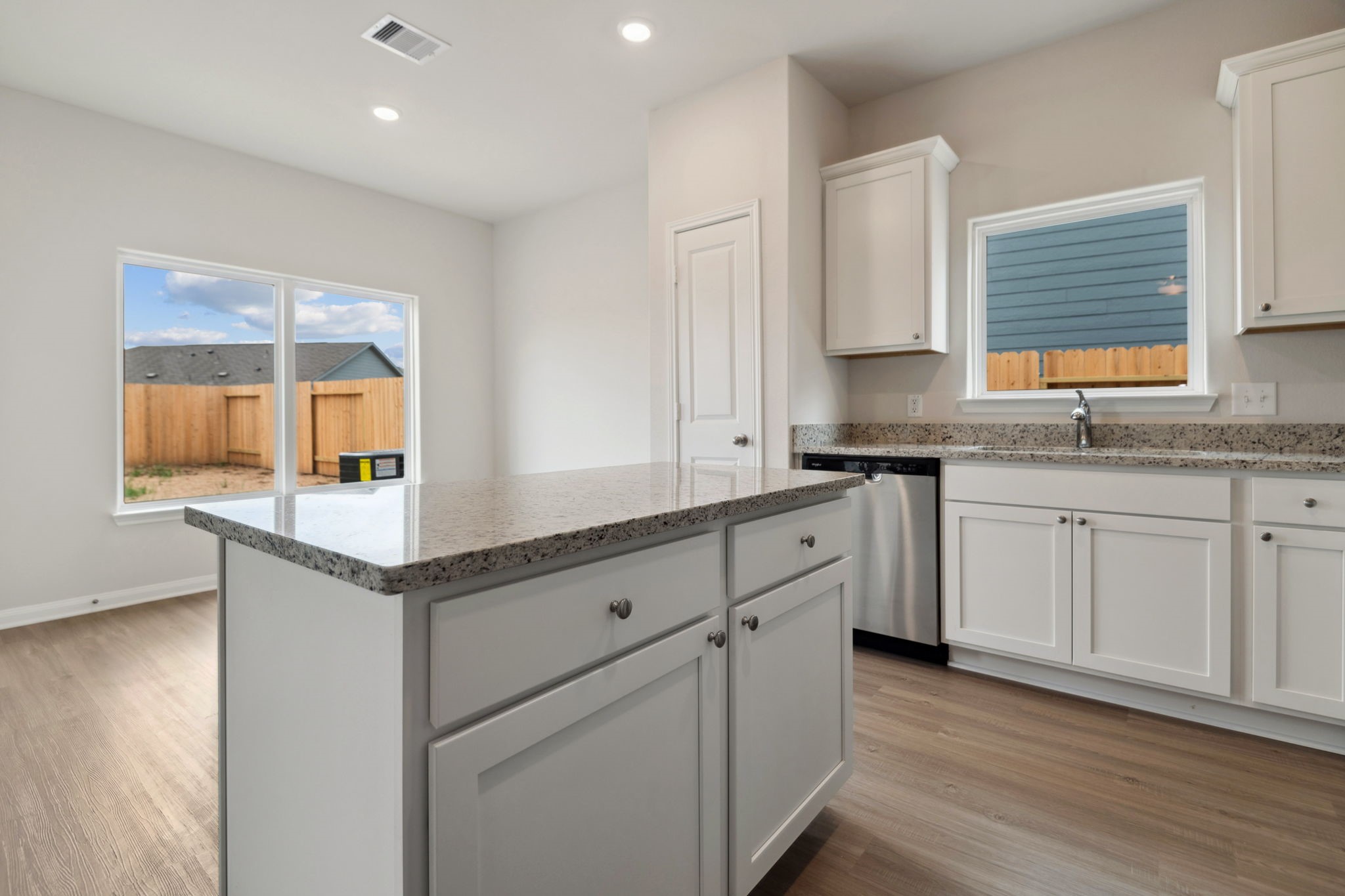 356 Fastboy Lane Waller, TX 77484 - Photo 16 of 23 a kitchen with granite countertop white cabinets and white appliances