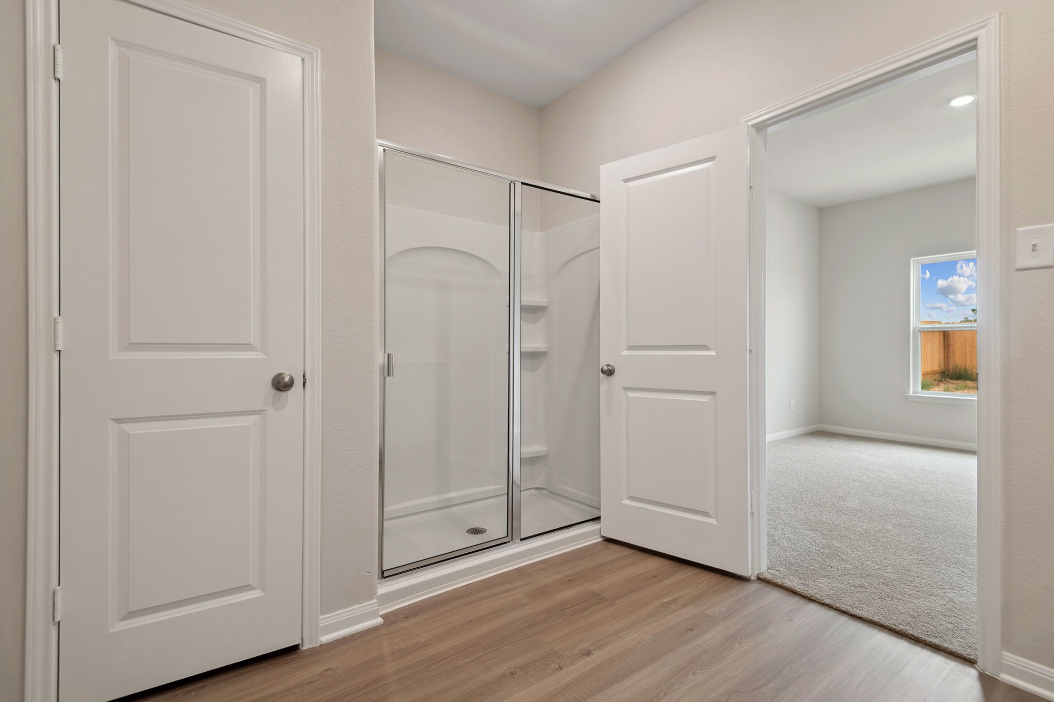 356 Fastboy Lane Waller, TX 77484 - Photo 20 of 23 a view of an empty room with wooden floor and closet area
