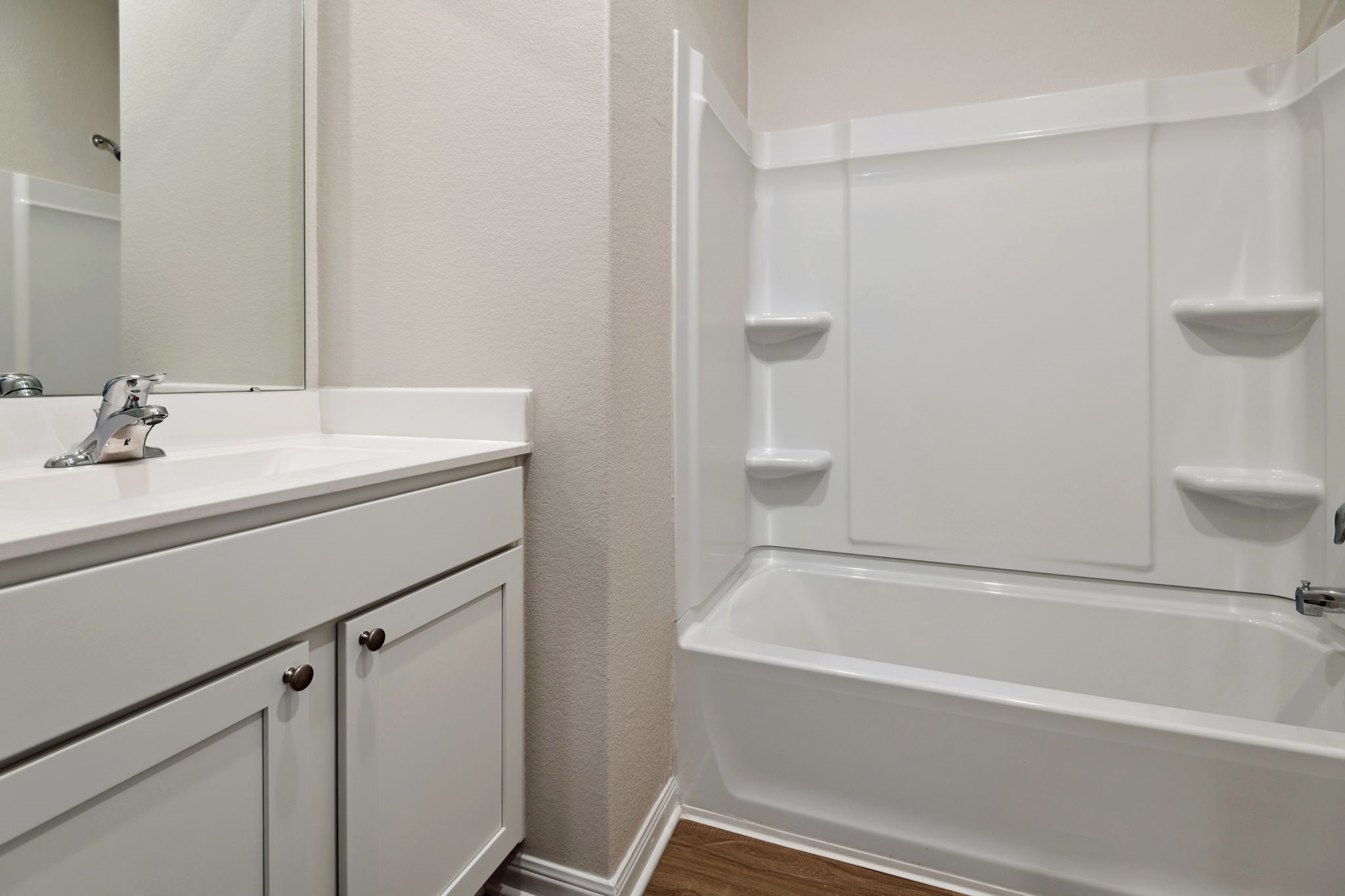 356 Fastboy Lane Waller, TX 77484 - Photo 3 of 23 a bathroom with a bathtub and a sink