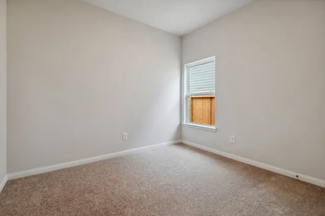 an empty room with closet area