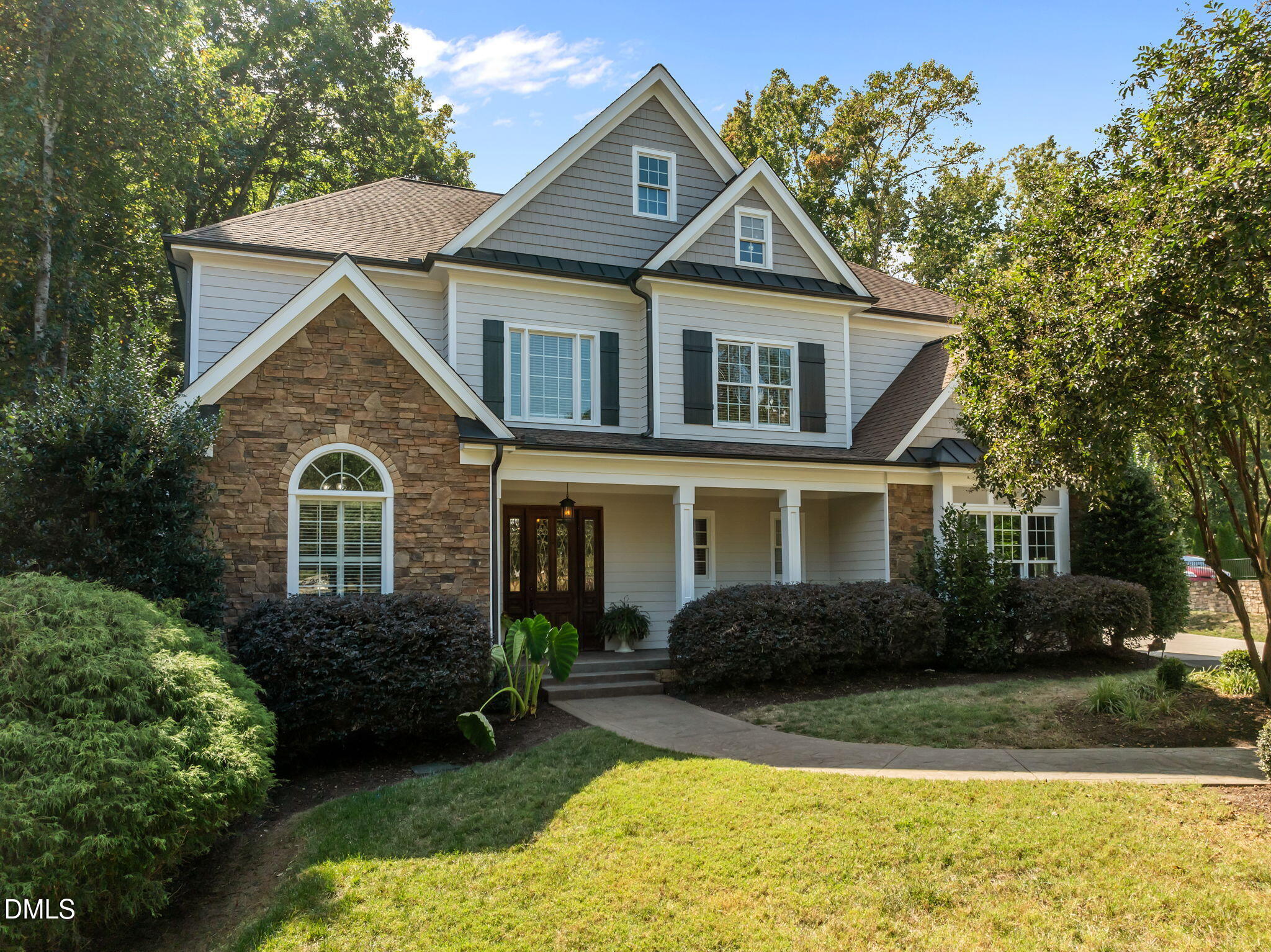 8802 Fidelis Lane Raleigh, NC 27613 - Photo 1 of 60 a front view of a house with garden