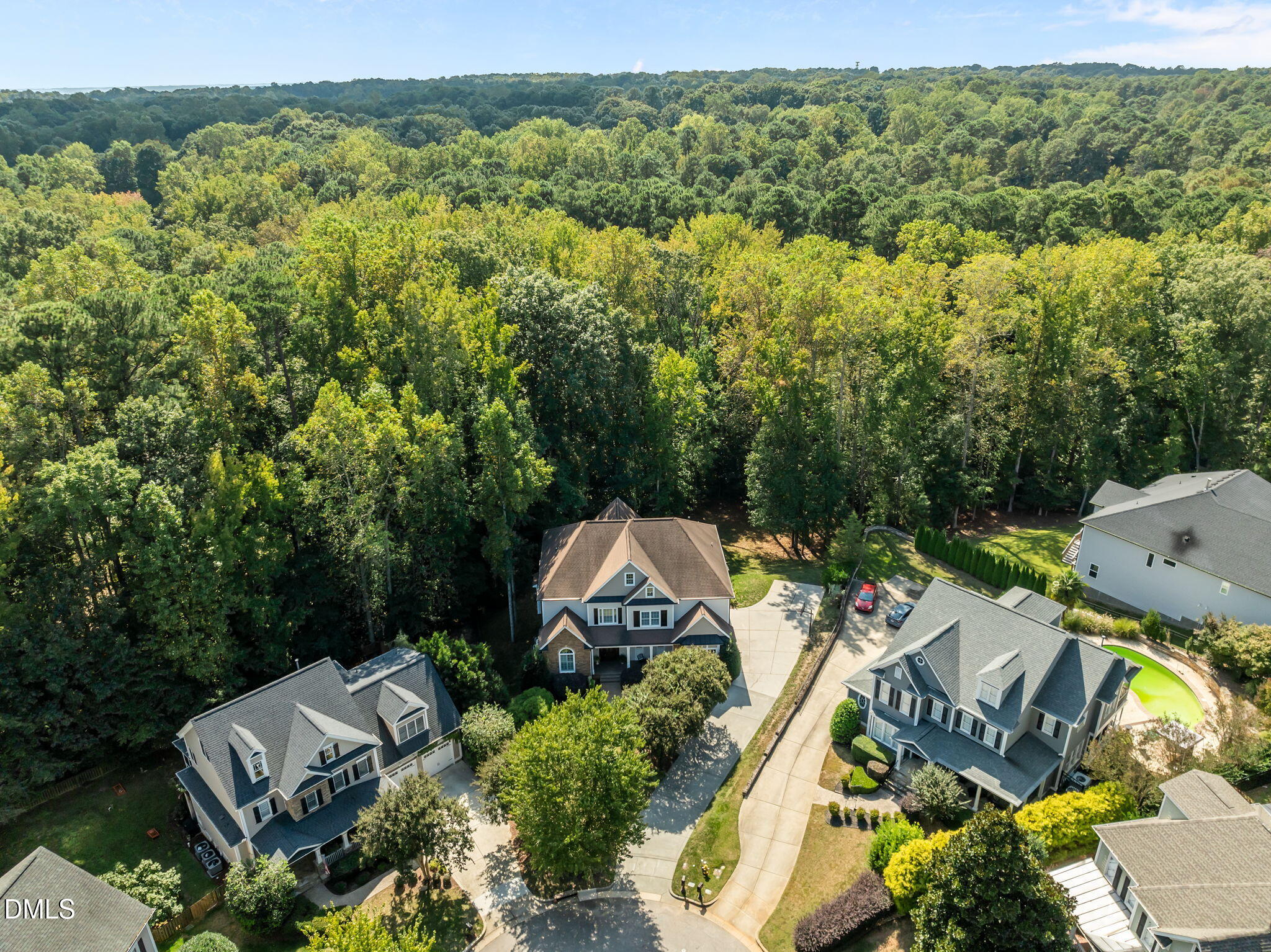 8802 Fidelis Lane Raleigh, NC 27613 - Photo 56 of 60 an aerial view of a house with a yard and lake view