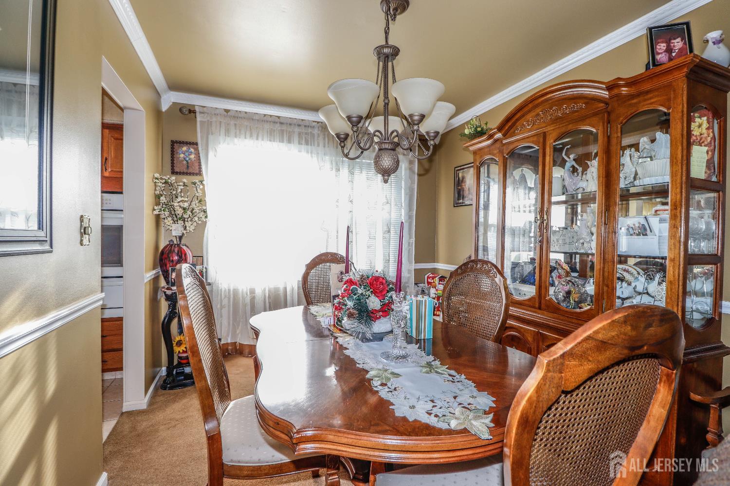 37 Patrick Street Carteret, NJ 07008 - Photo 13 of 30 a view of a dining room with furniture wooden floor and chandelier
