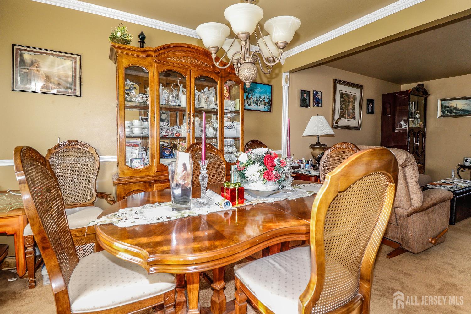 37 Patrick Street Carteret, NJ 07008 - Photo 14 of 30 a view of a dining room with furniture and chandelier