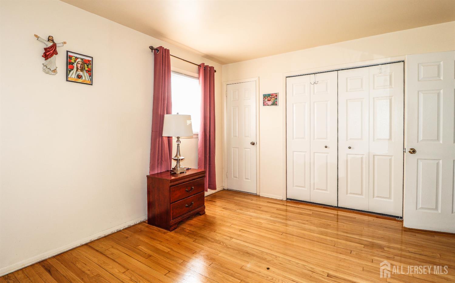 37 Patrick Street Carteret, NJ 07008 - Photo 19 of 30 a view of a bedroom with wooden floor and cabinet