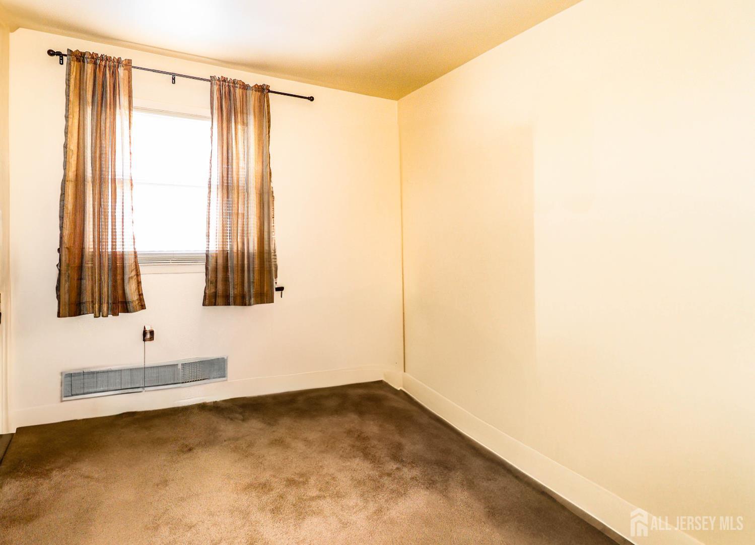 37 Patrick Street Carteret, NJ 07008 - Photo 21 of 30 a view of an empty room with a window