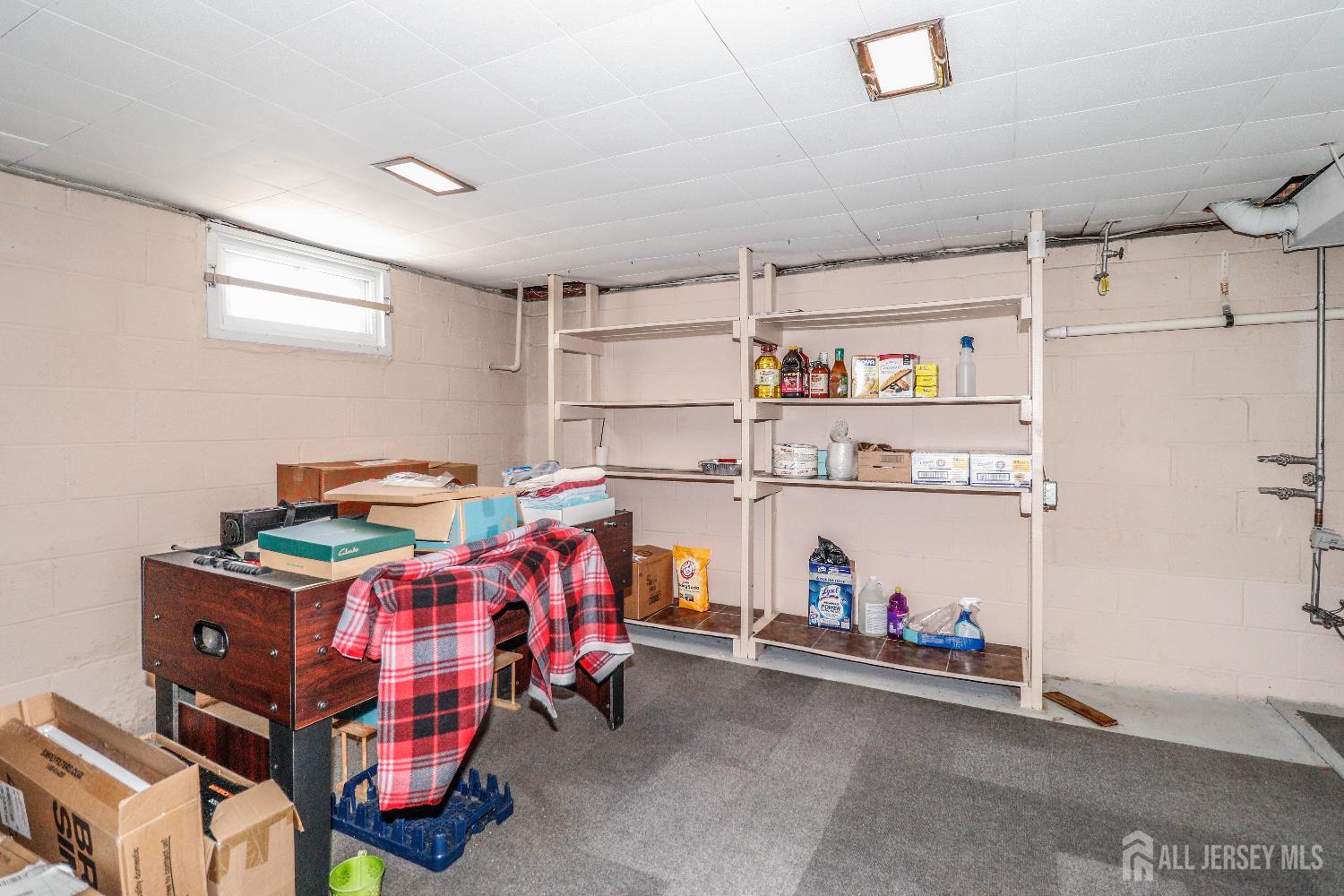 37 Patrick Street Carteret, NJ 07008 - Photo 26 of 30 a utility room with dryer and a refrigerator