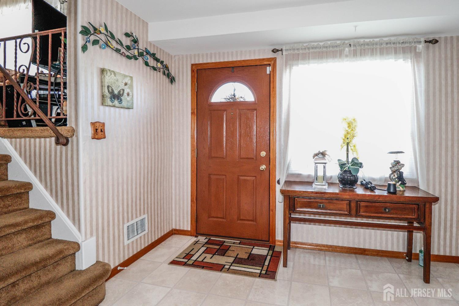 37 Patrick Street Carteret, NJ 07008 - Photo 7 of 30 a room with lots of frames and glass door