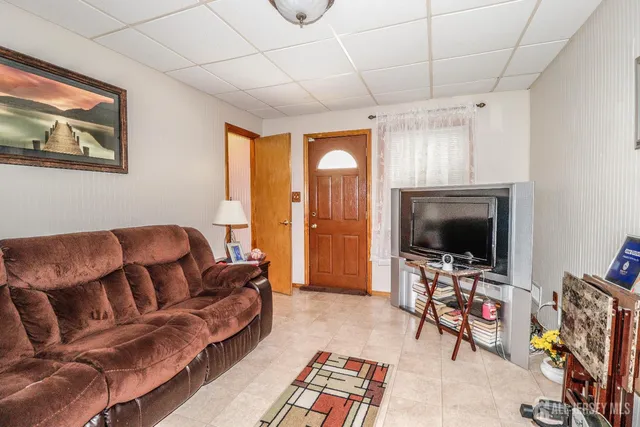 a living room with furniture and a rug