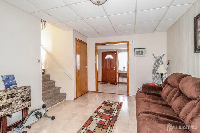 a bathroom with a sink a toilet and shower curtain