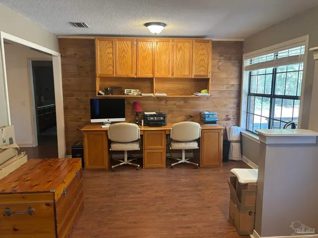 a workspace with furniture and a window