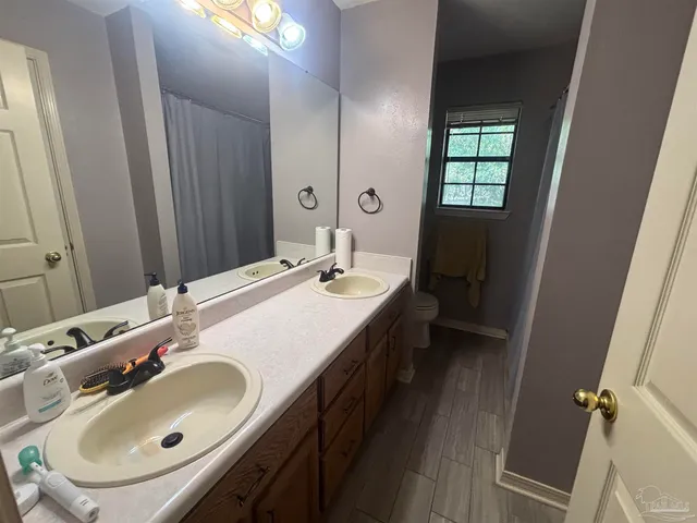 a view of a chairs and table in the patio