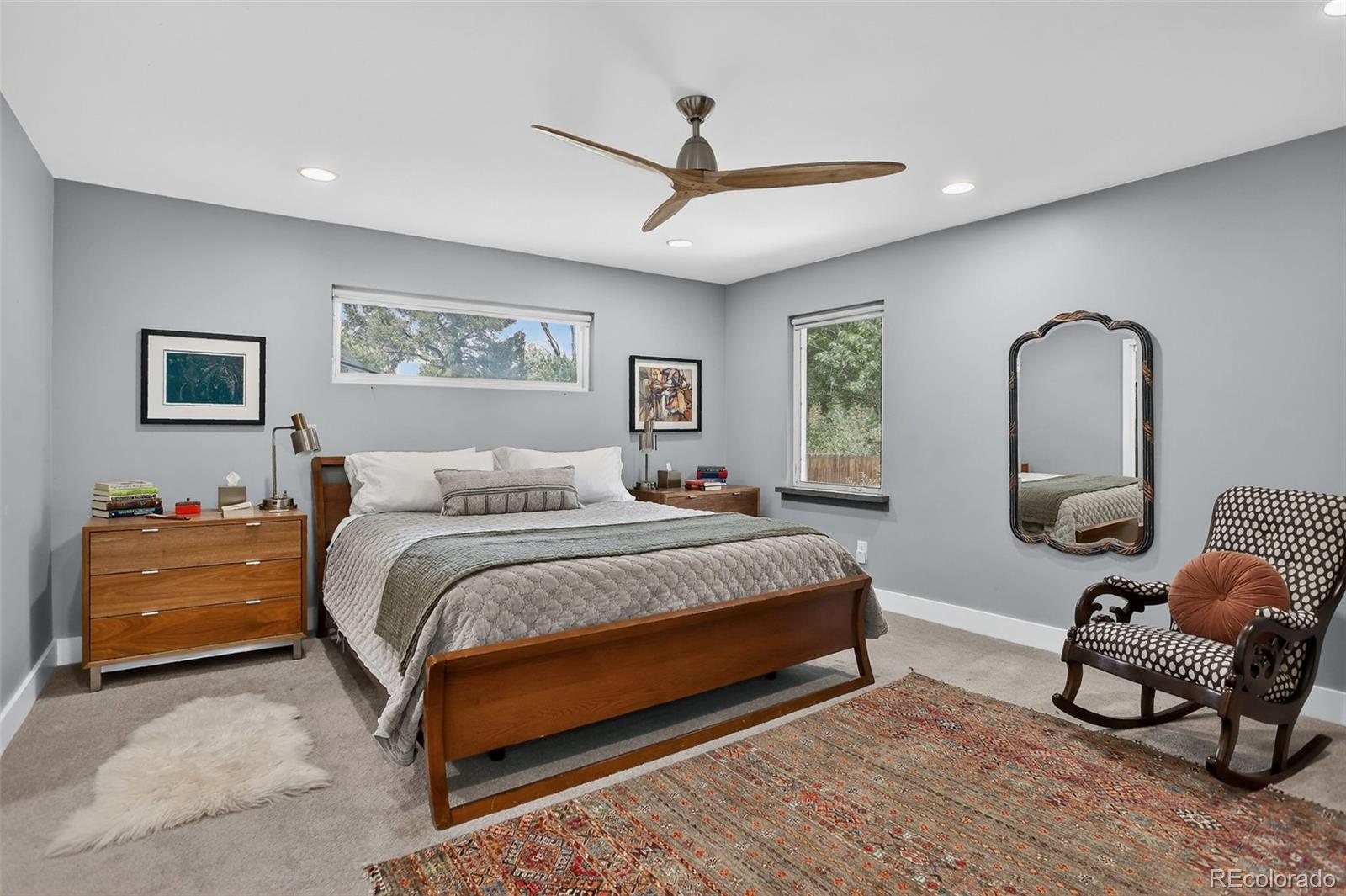 4595 West Lakeridge Road Denver, CO 80219 - Photo 12 of 50 a bed room with a bed and a chair