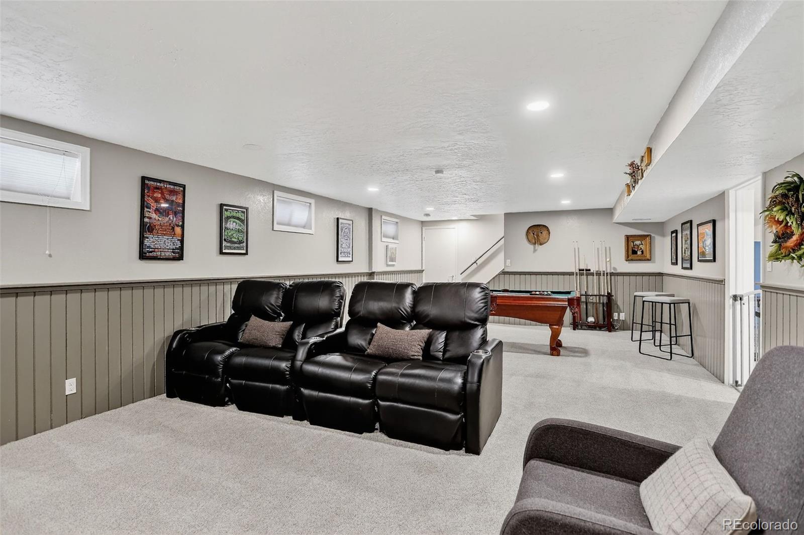 4595 West Lakeridge Road Denver, CO 80219 - Photo 24 of 50 a living room with furniture and a bookshelf