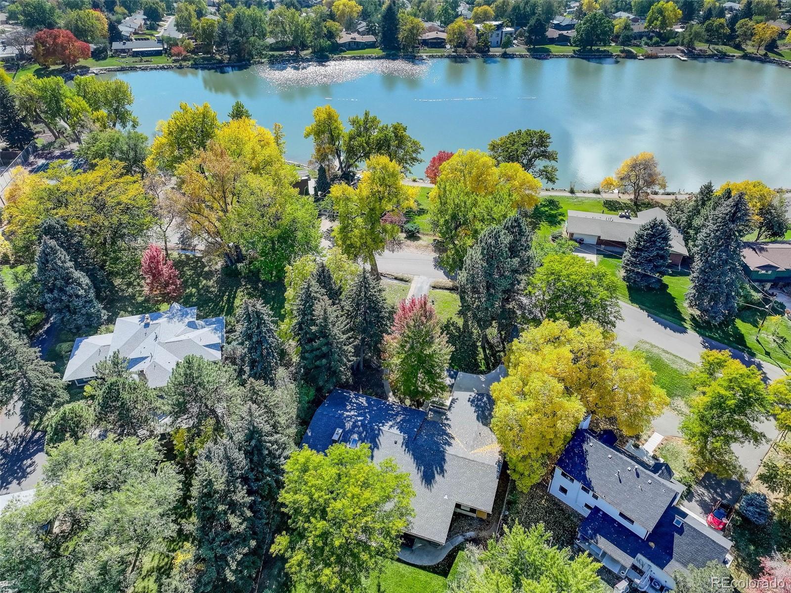 4595 West Lakeridge Road Denver, CO 80219 - Photo 39 of 50 an aerial view of a house with a lake view and a lake view
