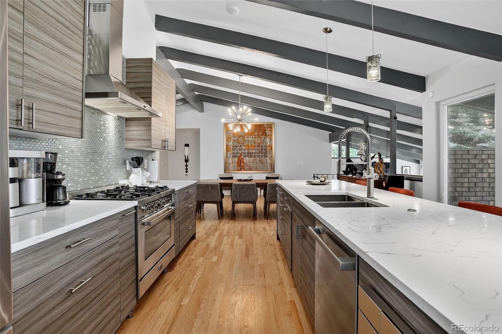 4595 West Lakeridge Road Denver, CO 80219 - Photo 5 of 50 a kitchen with granite countertop a sink stove and cabinets