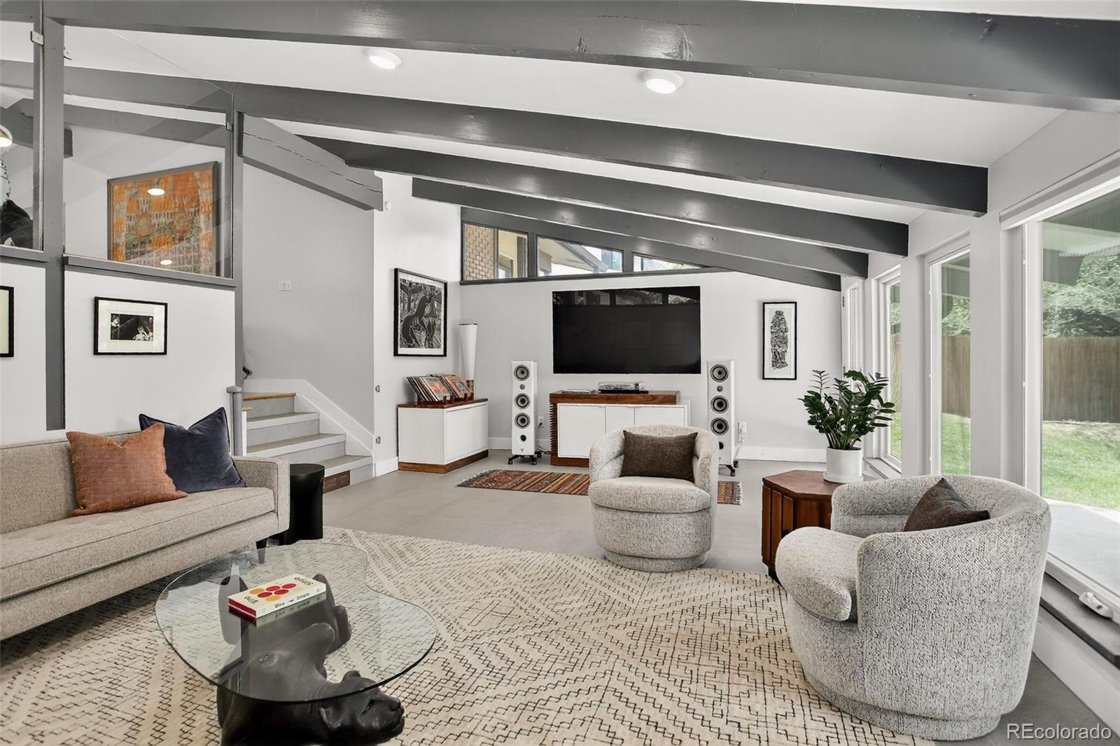 4595 West Lakeridge Road Denver, CO 80219 - Photo 8 of 50 a living room with furniture and a flat screen tv