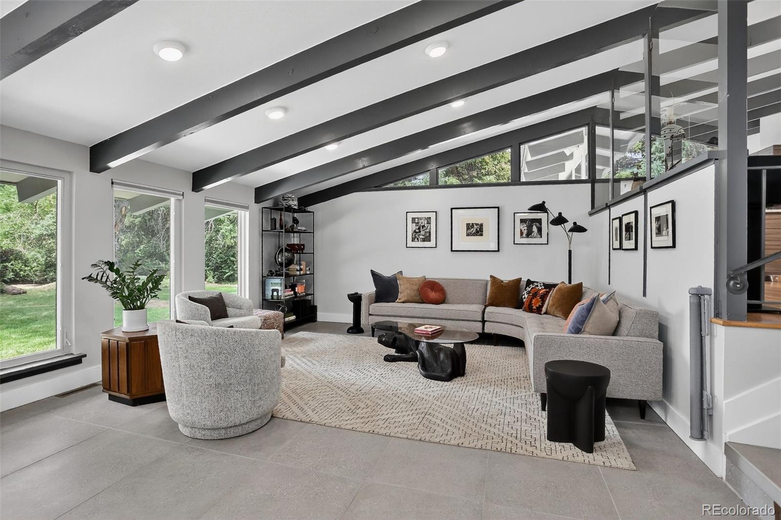4595 West Lakeridge Road Denver, CO 80219 - Photo 9 of 50 a living room with furniture and a large window