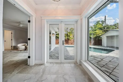 a view of a room that has a bed and a window