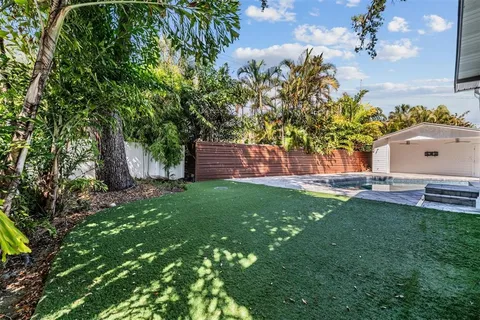 a backyard of a house with seating space