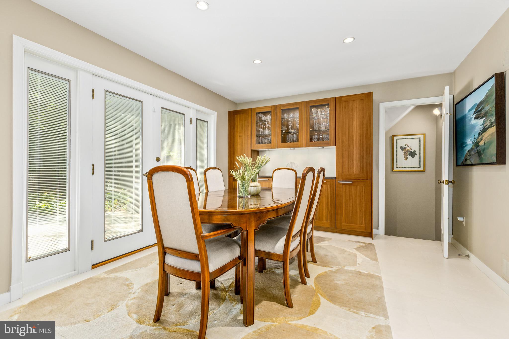 4225 50th Street Northwest Washington, DC 20016 - Photo 11 of 30 a view of a dining room with furniture and chandelier