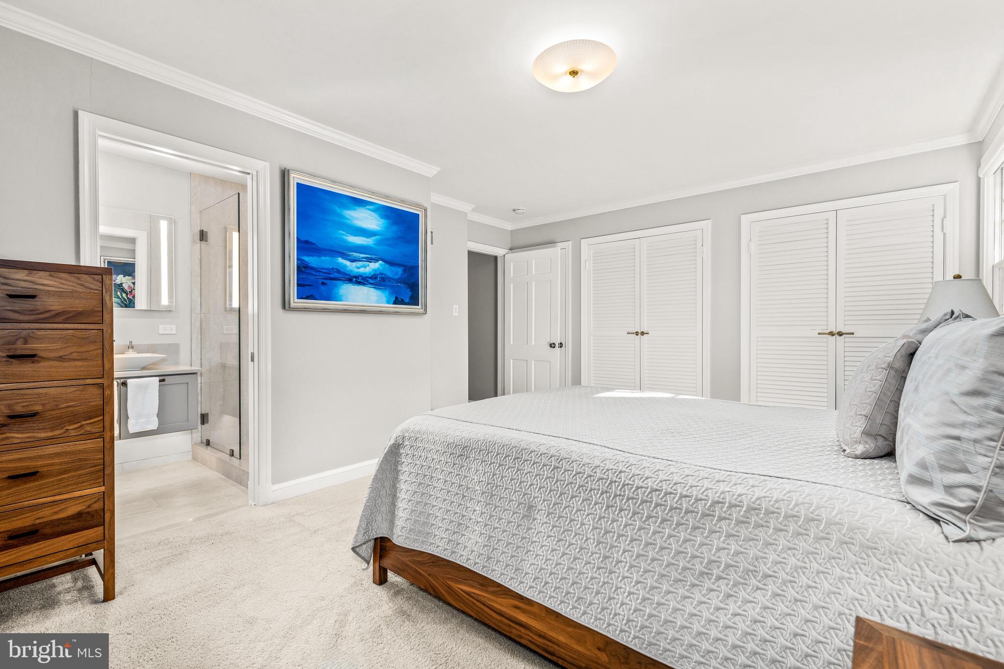 4225 50th Street Northwest Washington, DC 20016 - Photo 14 of 30 a bedroom with a bed and a cabinets