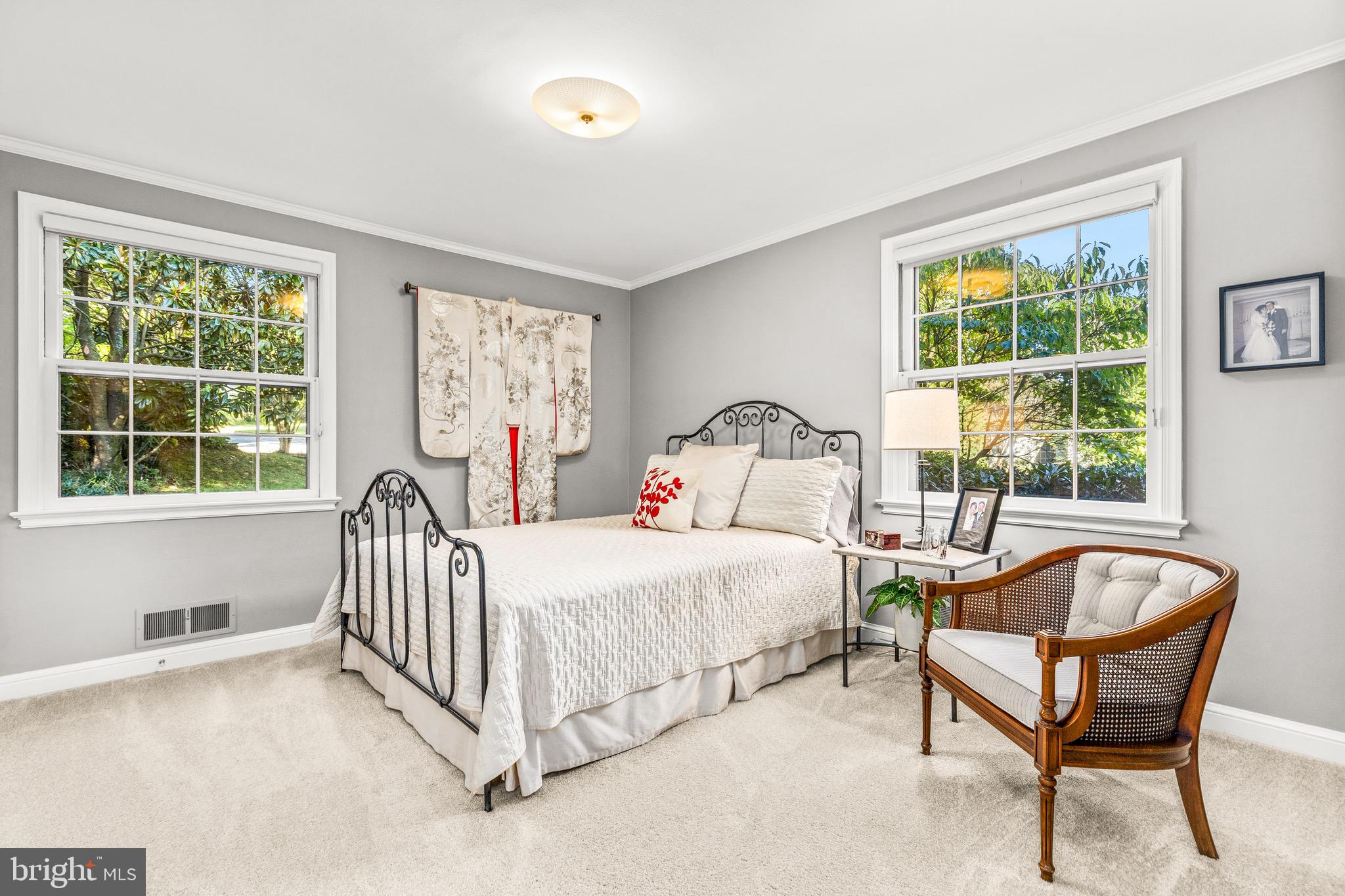 4225 50th Street Northwest Washington, DC 20016 - Photo 16 of 30 a bedroom with a bed and a window