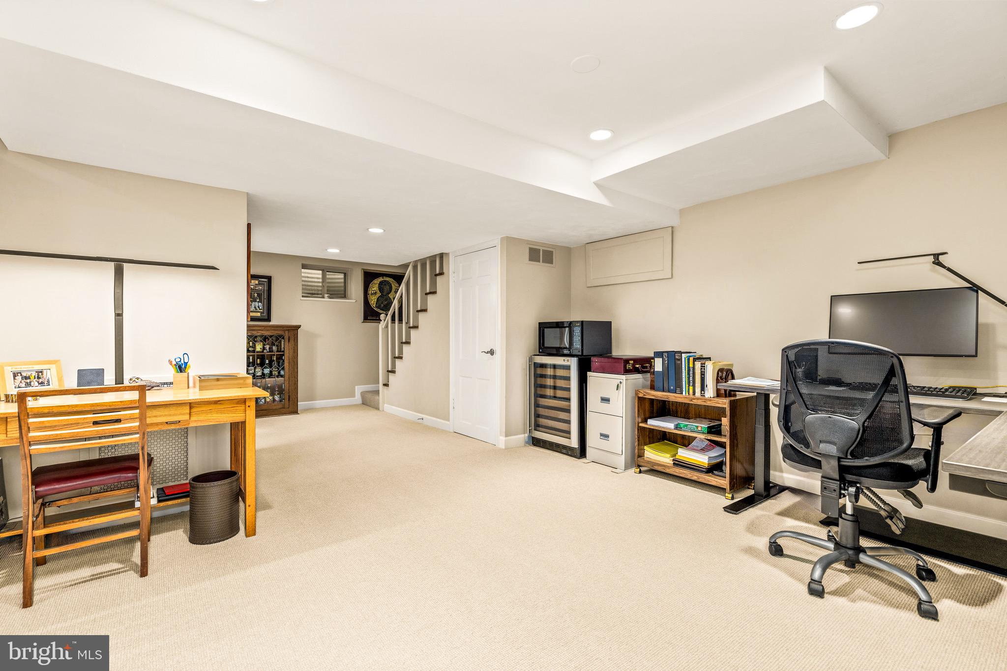 4225 50th Street Northwest Washington, DC 20016 - Photo 20 of 30 a view of a workspace with furniture and a bathroom