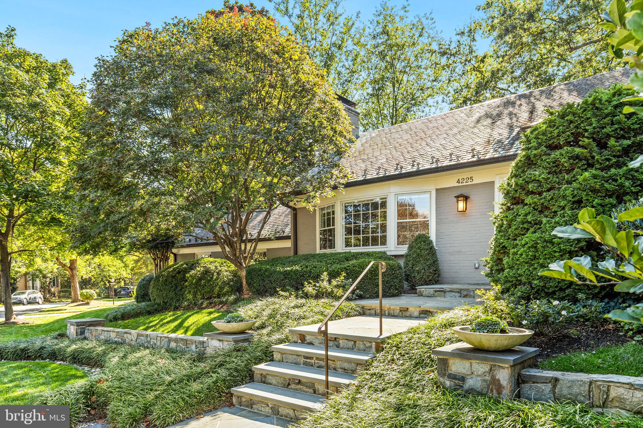 4225 50th Street Northwest Washington, DC 20016 - Photo 2 of 30 a view of backyard with table and chairs and potted plants