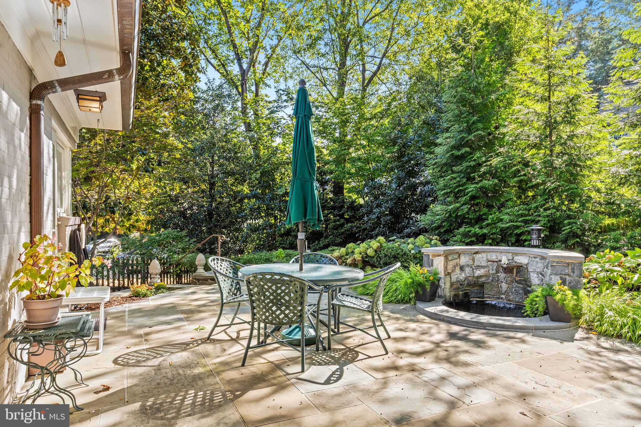 4225 50th Street Northwest Washington, DC 20016 - Photo 26 of 30 a view of patio with table and chairs and potted plants