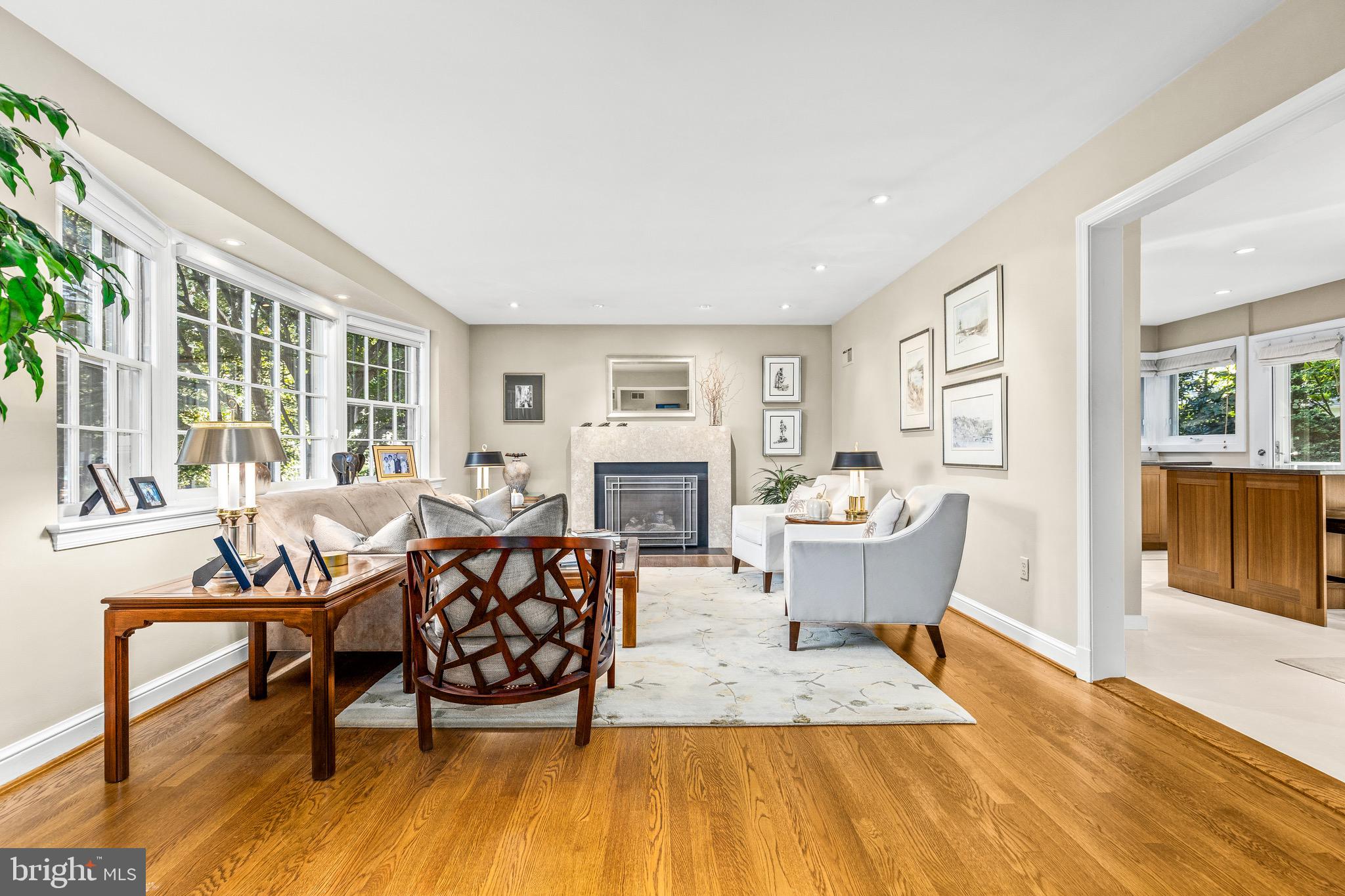 4225 50th Street Northwest Washington, DC 20016 - Photo 6 of 30 a living room with fireplace furniture and a wooden floor