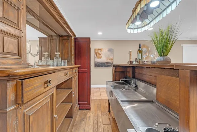 a kitchen with a sink appliances and cabinets