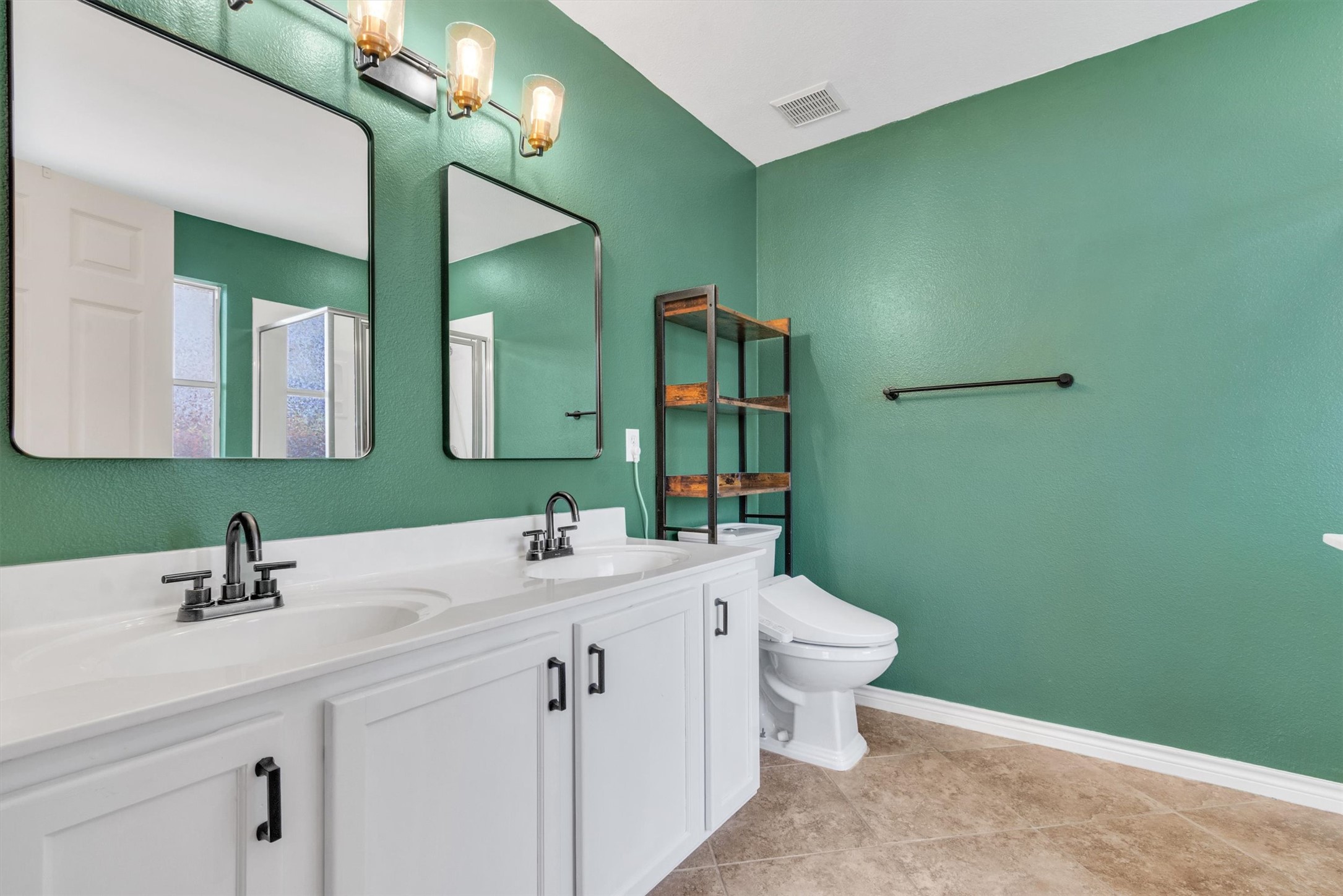 100 Madisons Way Buda, TX 78610 - Photo 19 of 30 Bathroom featuring double vanity and a stall shower