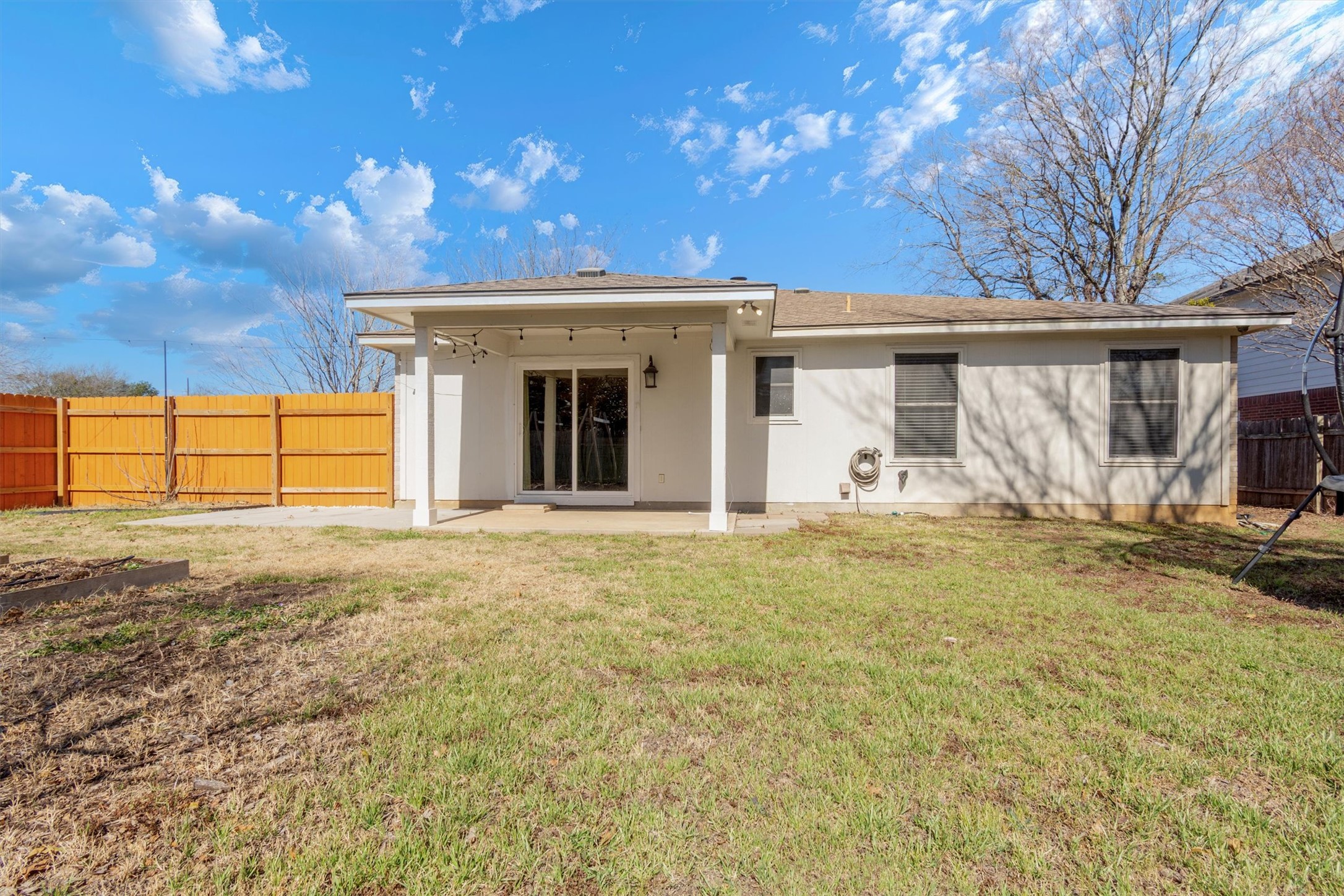 100 Madisons Way Buda, TX 78610 - Photo 25 of 30 Rear view of property with a fenced backyard, a patio, stucco siding, and a shingled roof
