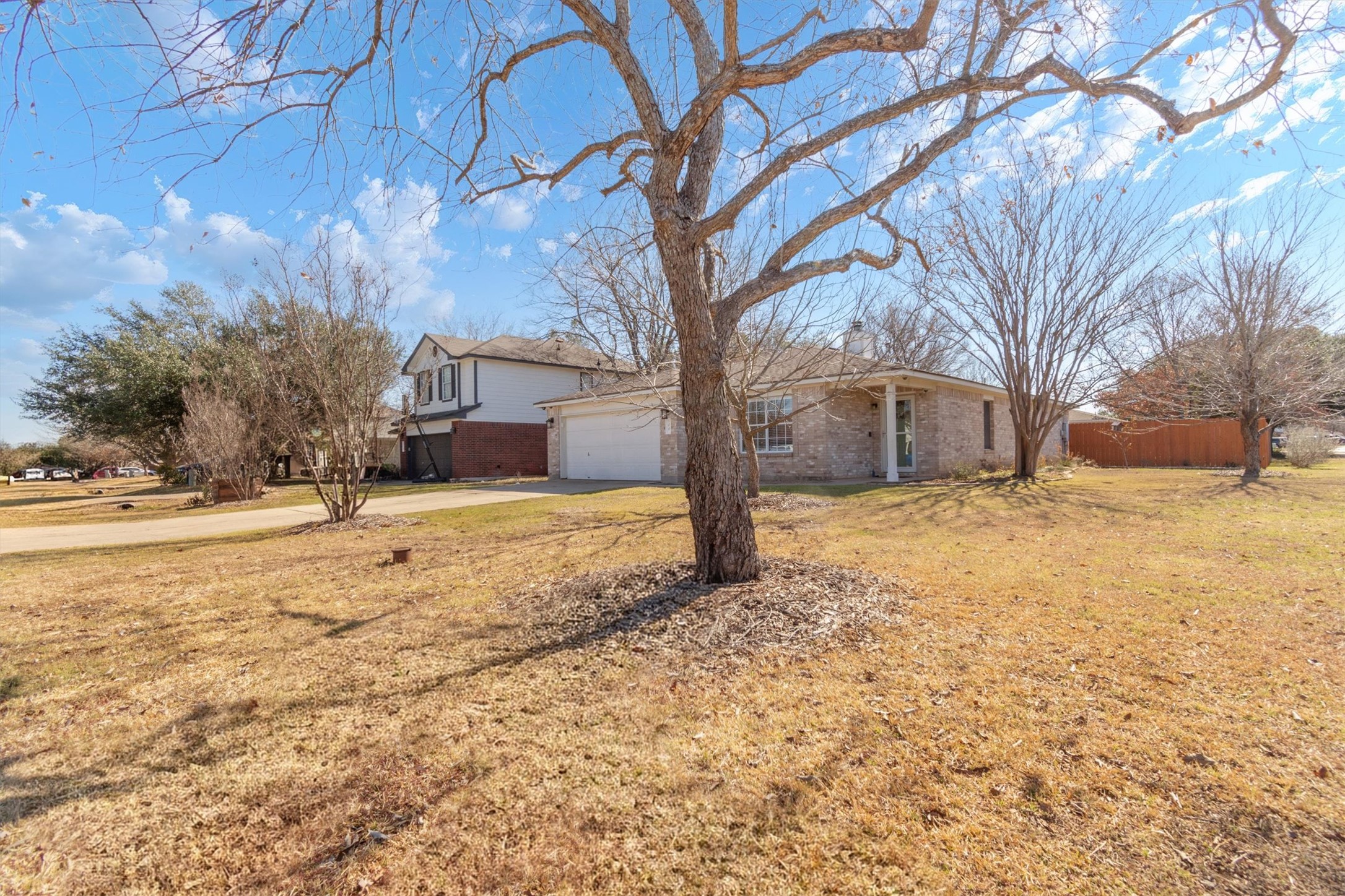 100 Madisons Way Buda, TX 78610 - Photo 4 of 30 View of front of house featuring concrete driveway and brick siding