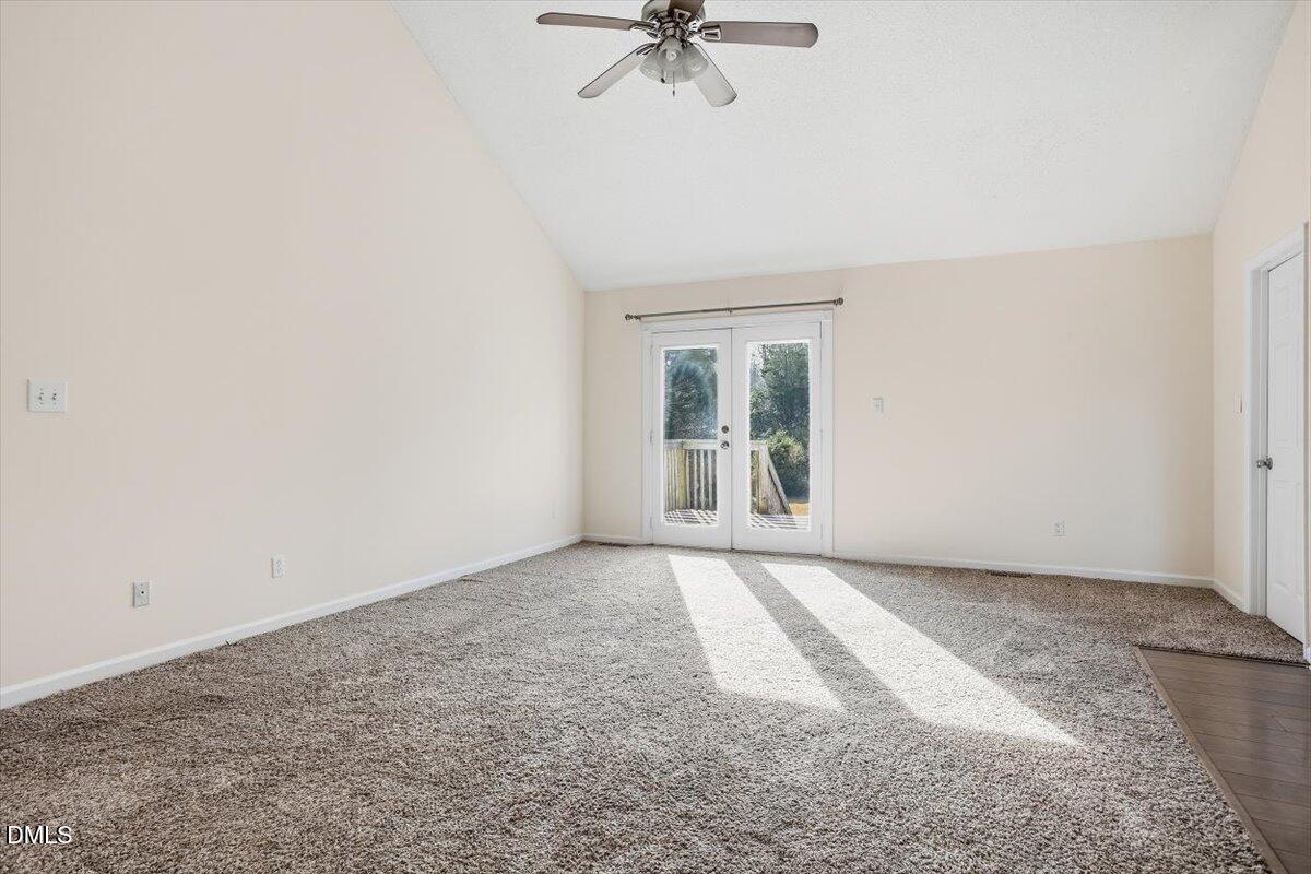 1334 Langdon Road Angier, NC 27501 - Photo 14 of 36 an empty room with a window and a ceiling fan