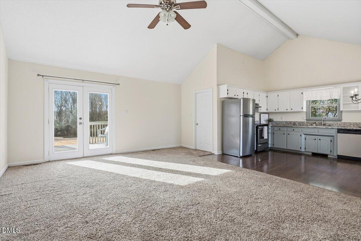 1334 Langdon Road Angier, NC 27501 - Photo 17 of 36 a view of a kitchen with refrigerator and white cabinets