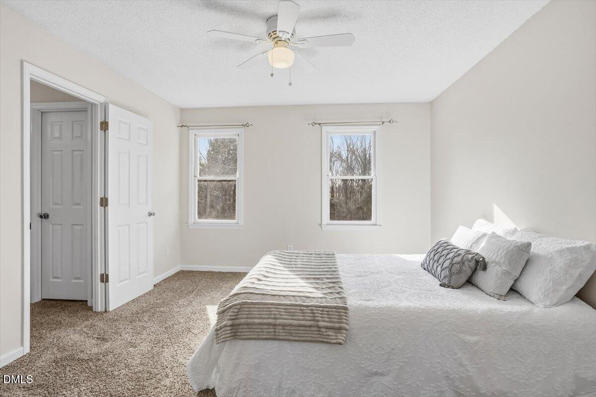 1334 Langdon Road Angier, NC 27501 - Photo 28 of 36 a bedroom with a bed and a window