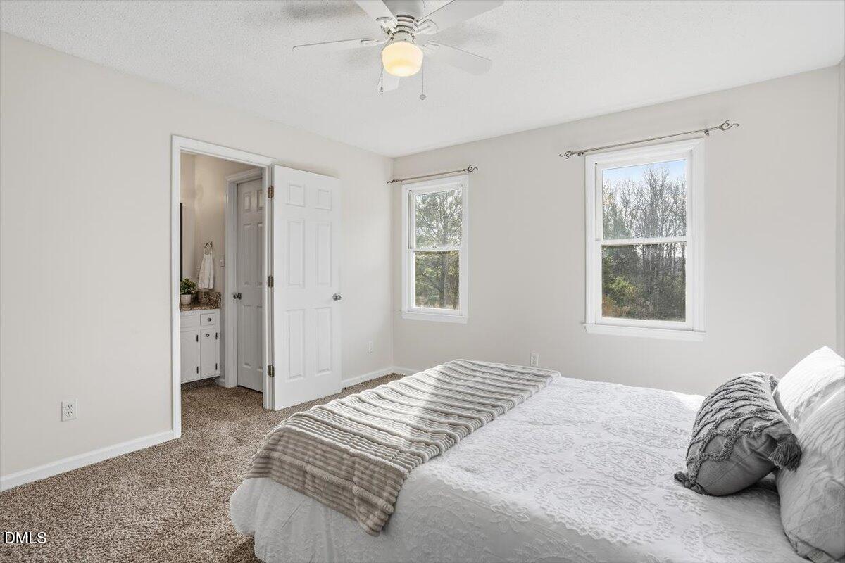 1334 Langdon Road Angier, NC 27501 - Photo 29 of 36 a bedroom with a bed and a window