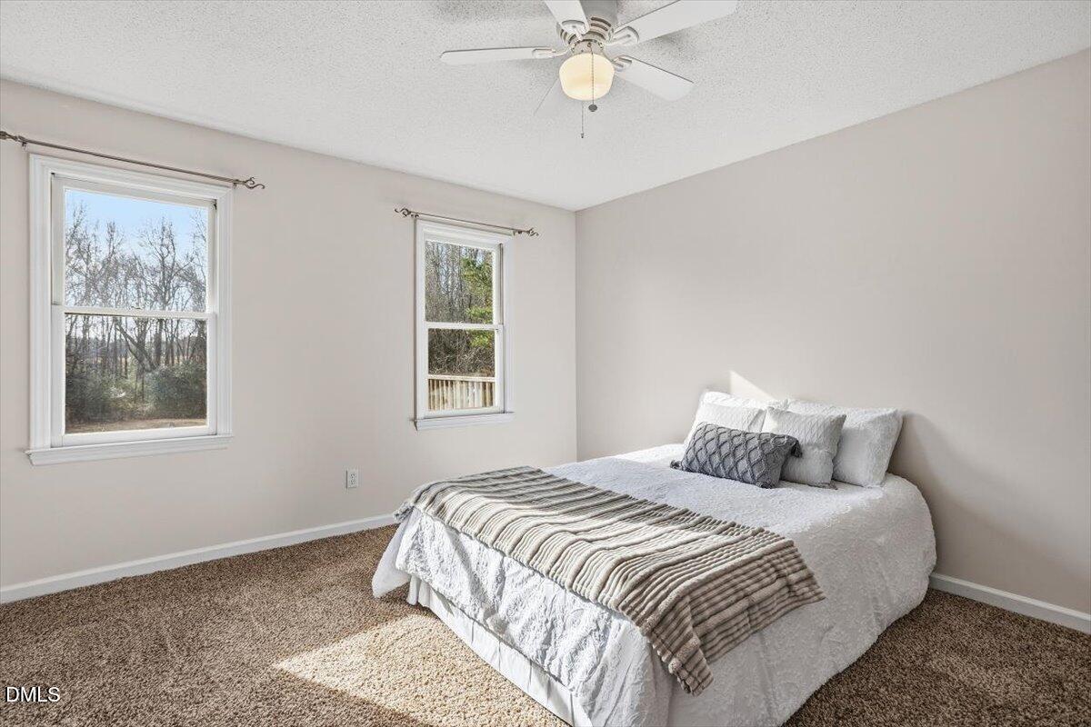 1334 Langdon Road Angier, NC 27501 - Photo 30 of 36 a bedroom with a bed and a window