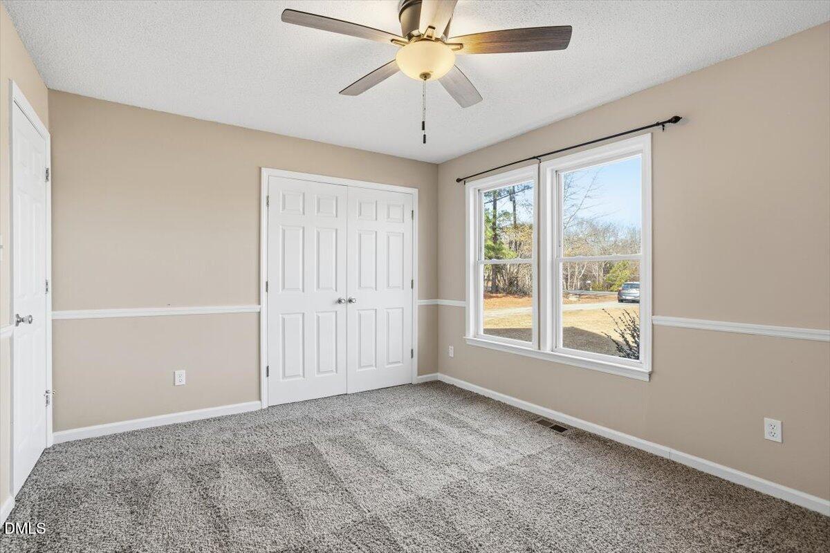 1334 Langdon Road Angier, NC 27501 - Photo 32 of 36 a view of an empty room with a window