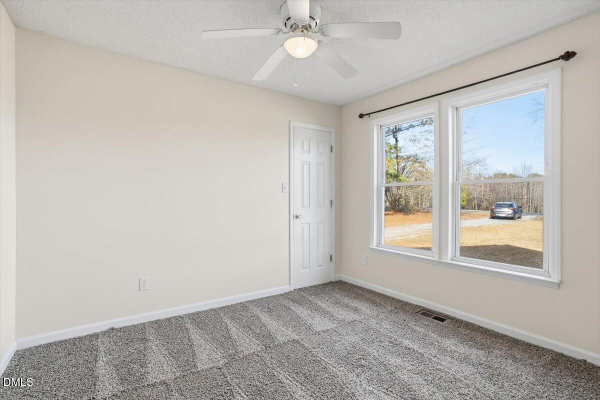 1334 Langdon Road Angier, NC 27501 - Photo 34 of 36 an empty room with a window