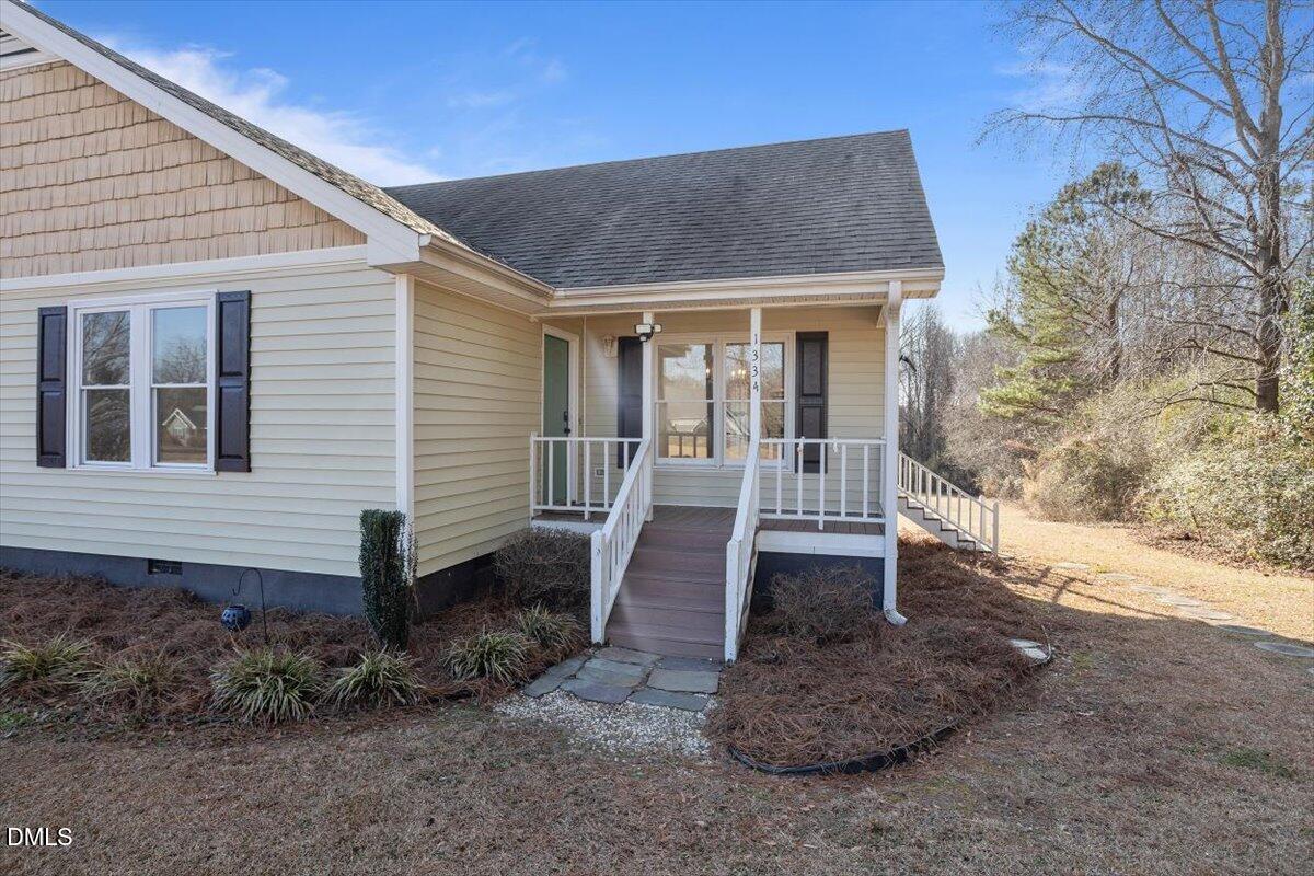 1334 Langdon Road Angier, NC 27501 - Photo 5 of 36 a front view of a house with garden