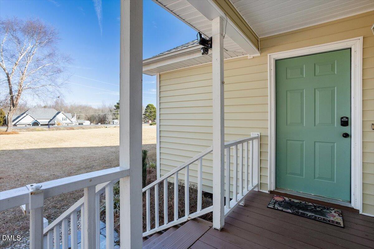 1334 Langdon Road Angier, NC 27501 - Photo 7 of 36 a view of a porch with wooden floor and fence