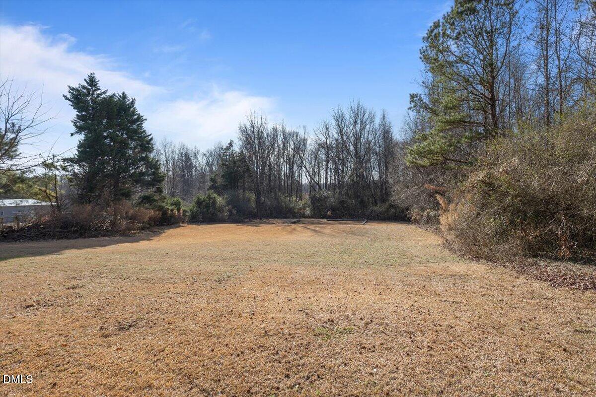 1334 Langdon Road Angier, NC 27501 - Photo 8 of 36 a backyard of a house