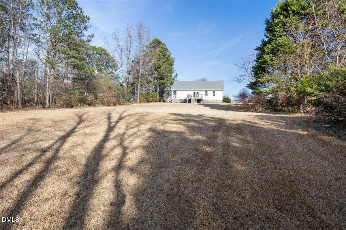 1334 Langdon Road Angier, NC 27501 - Photo 9 of 36 a view of a backyard of a house