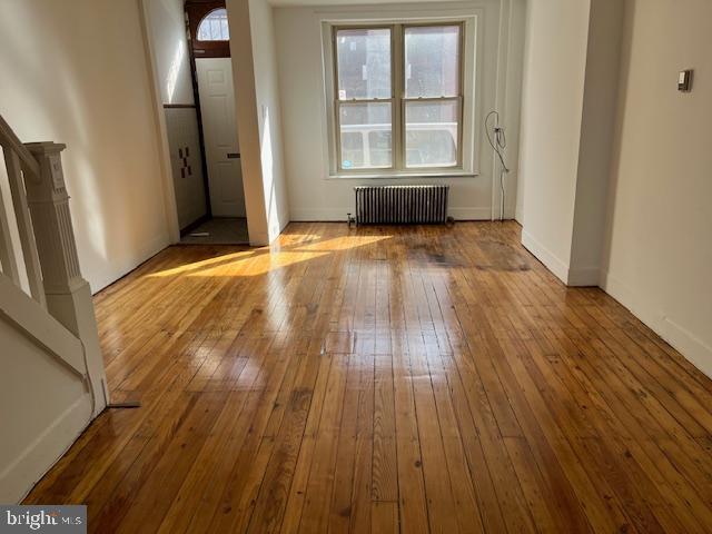 619 Fitzgerald Street Philadelphia, PA 19148 - Photo 5 of 14 an empty room with wooden floor and windows