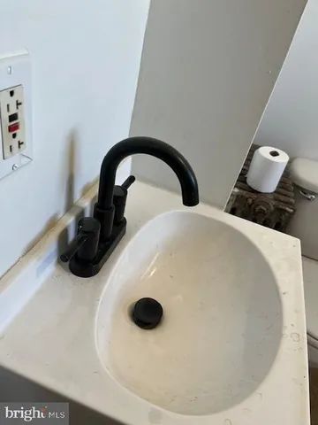 a view of a room with wooden floor and white walls