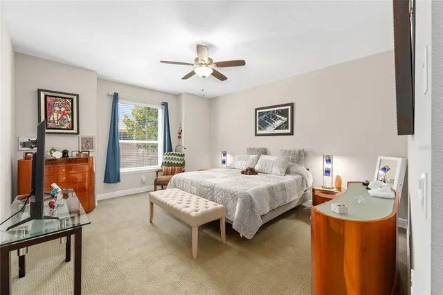 a bedroom with a bed and a table