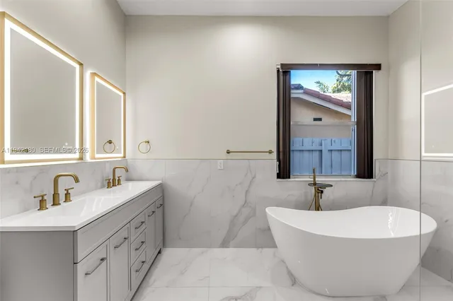 a bathroom with a bathtub and a sink